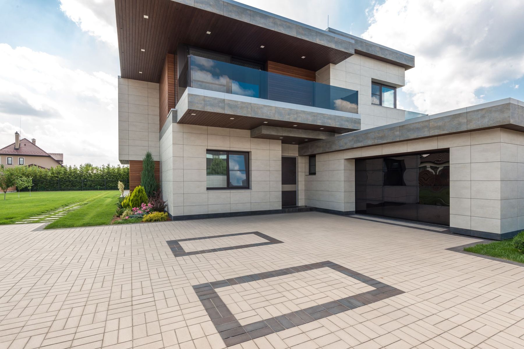 A bright, minimal custom home exterior in daylight