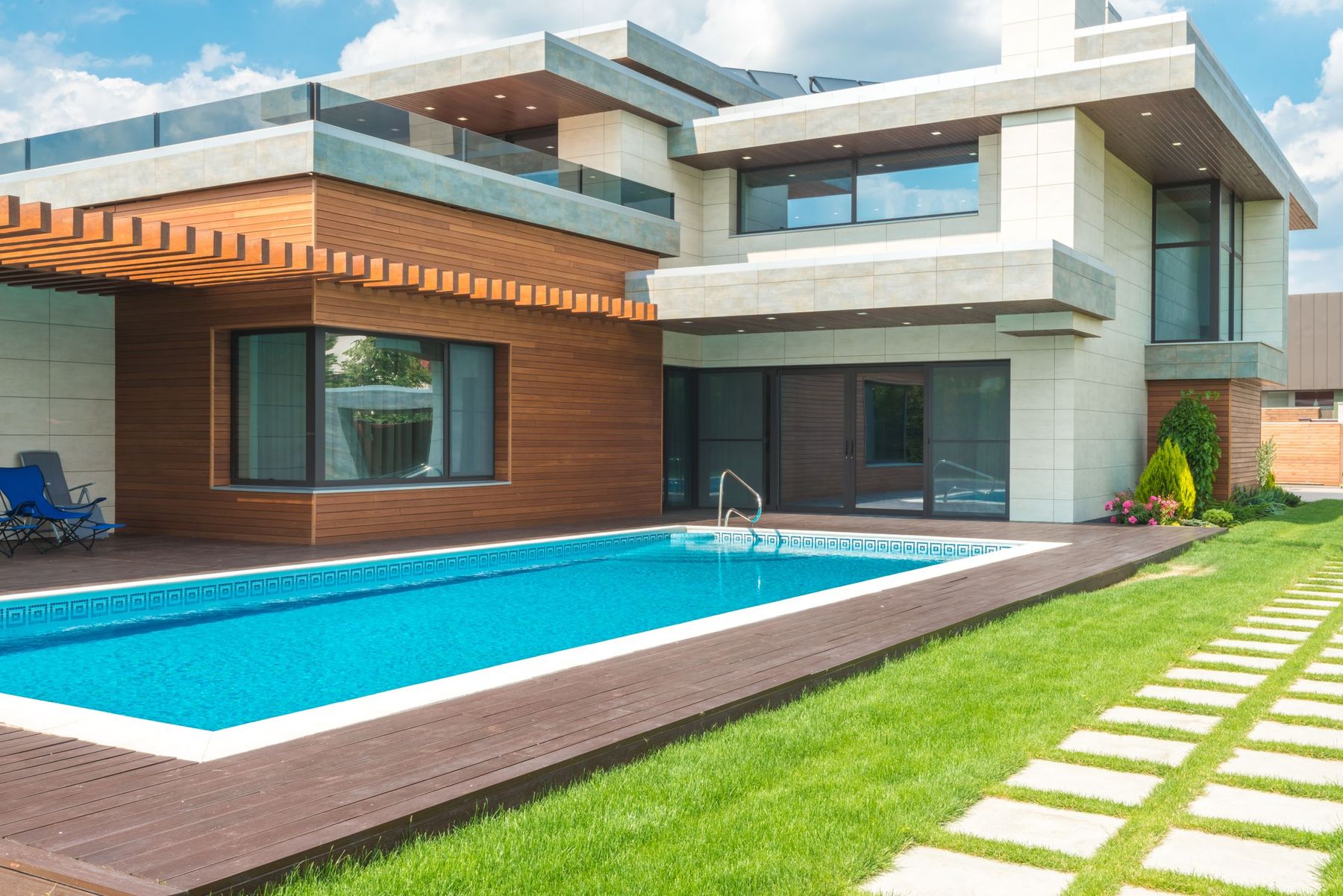 Bright custom home exterior with a pool